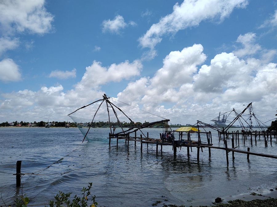 Chinese fishing nets on wooden frames along the waterfront in Kochi, Kerala