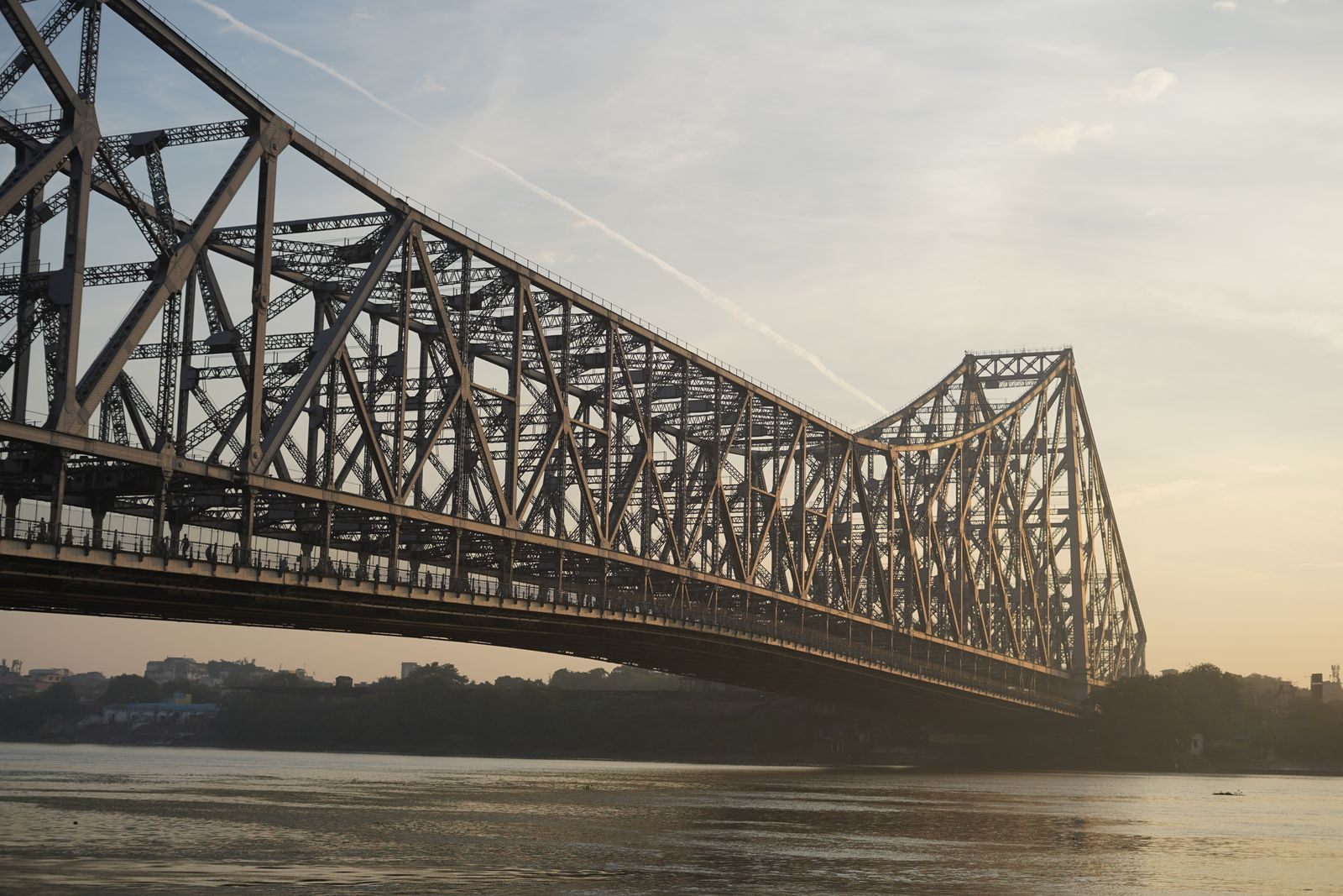 Howrah Bridge over the Hooghly at sunrise in Kolkata, where most India luxury river cruise voyages begin
